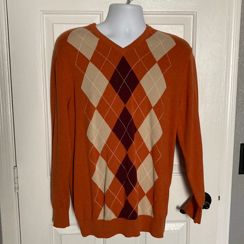 Men’s orange argyle sweater,